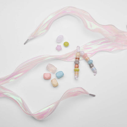 Colorful-beaded-Charms-with-pink-Laces-on-a-white-background
