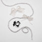 Silver-glitter-laces-with-pearl-and-ribbon-bows-and-black-heart-charm