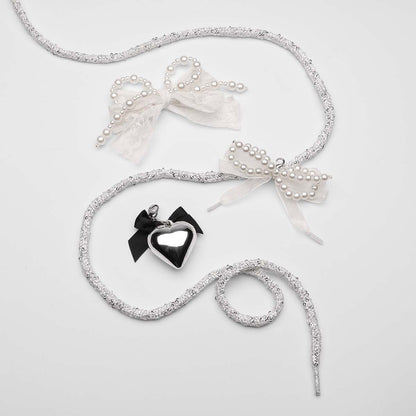 Silver-glitter-laces-with-pearl-and-ribbon-bows-and-black-heart-charm