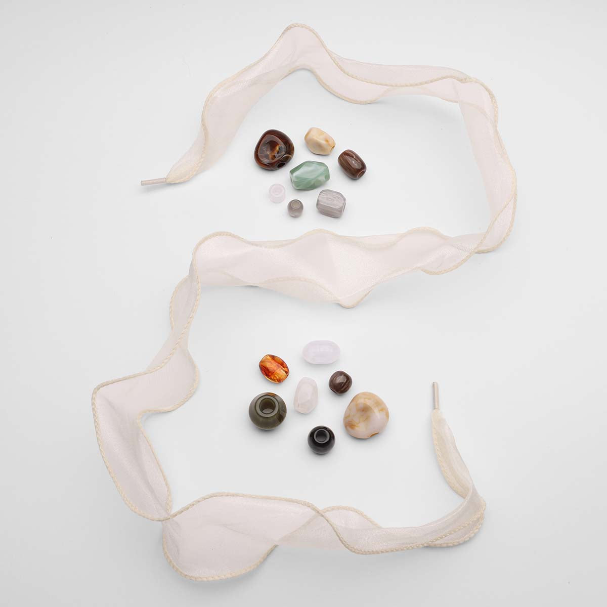 Cream-sheer-laces-with-various-colored-stone-charms