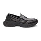 Black-slip-on-shoe-with-a-thick-sole-on-a-white-background
