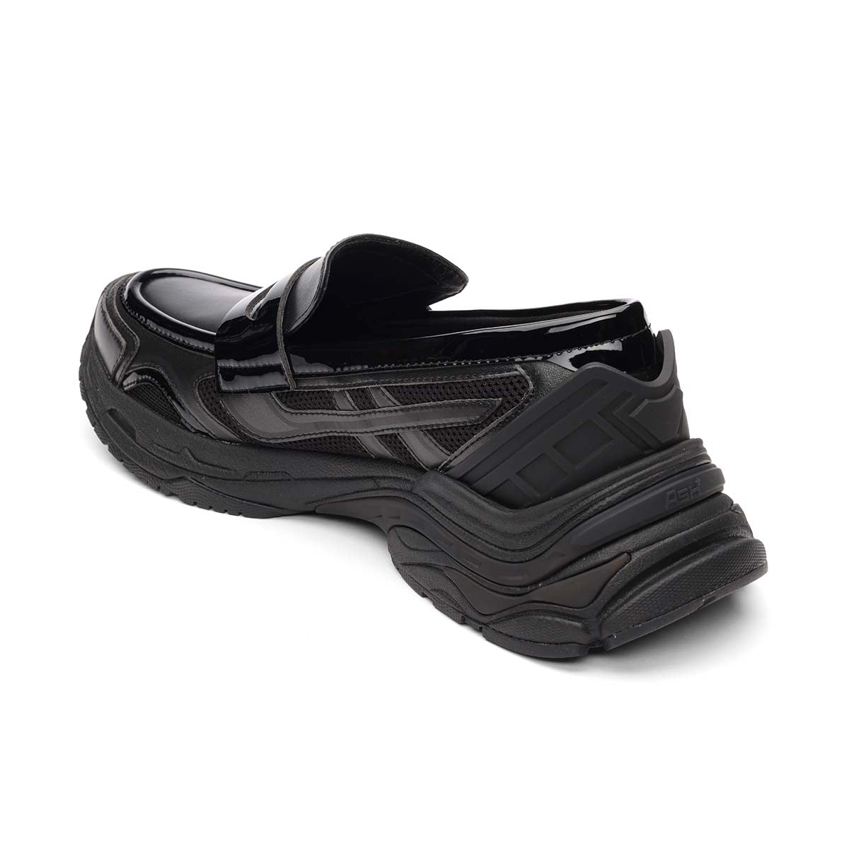 Black-slip-on-shoe-with-a-unique-sole-design-on-a-white-background